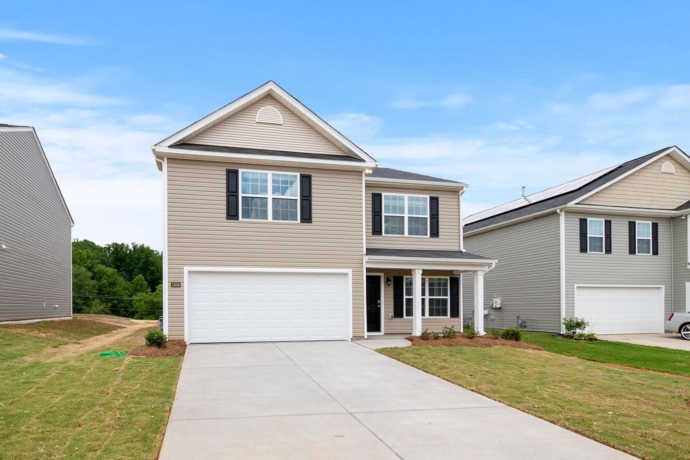 White double garage door on a suburban Waco home, the size of door most repair pricing is based on